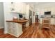 Kitchen with white cabinets, butcher block island, and hardwood floors at 1108 S Palmetto Ave, Sanford, FL 32771