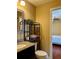 Bathroom with granite countertop and dark vanity at 121 Wimbledon Cir, Lake Mary, FL 32746