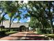 Gated entrance to a community with lush landscaping and brick pavers at 121 Wimbledon Cir, Lake Mary, FL 32746