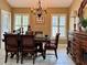 Formal dining room featuring a large wood table and sideboard at 121 Wimbledon Cir, Lake Mary, FL 32746