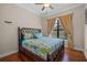 Guest bedroom with a king-size bed and hardwood floors at 12435 Montalcino Cir, Windermere, FL 34786