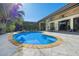 Inviting kidney-shaped pool with spa and patio at 12435 Montalcino Cir, Windermere, FL 34786