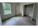 Cozy bedroom with a window offering a natural light and a spacious closet at 13188 Sw Sw 65Th Cir, Ocala, FL 34473