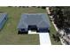 Overhead front view of a single-story home with a two-car garage and manicured lawn at 13188 Sw Sw 65Th Cir, Ocala, FL 34473