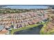 Aerial view of large community by the lake at 13567 Abberwick Dr, Orlando, FL 32832