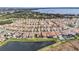 Aerial view of community with lake and many homes at 13567 Abberwick Dr, Orlando, FL 32832