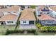 Backyard view of home with patio and fenced yard at 13567 Abberwick Dr, Orlando, FL 32832