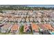 Aerial view of community with lake and many homes at 13567 Abberwick Dr, Orlando, FL 32832