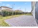 Large backyard with paver patio and grassy area at 13567 Abberwick Dr, Orlando, FL 32832