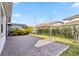 Private backyard with brick pavers and a screened enclosure at 13567 Abberwick Dr, Orlando, FL 32832