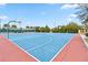 Outdoor basketball court with blue and red surface at 13567 Abberwick Dr, Orlando, FL 32832