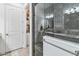 Modern bathroom with a glass-enclosed shower and a walk-in closet at 13567 Abberwick Dr, Orlando, FL 32832