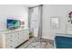 Bedroom with twin bed, dresser, and a large window with natural light at 13567 Abberwick Dr, Orlando, FL 32832