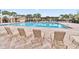 Inviting community pool with lounge chairs and shaded areas at 13567 Abberwick Dr, Orlando, FL 32832