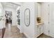 Bright and spacious entryway with built-in shelving and mirror at 13567 Abberwick Dr, Orlando, FL 32832