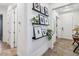 Hallway with floating shelves and framed artwork at 13567 Abberwick Dr, Orlando, FL 32832