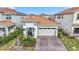 One-story home with tile roof, two-car garage, and landscaping at 13567 Abberwick Dr, Orlando, FL 32832