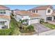One-story home with tile roof, two-car garage, and landscaped yard at 13567 Abberwick Dr, Orlando, FL 32832