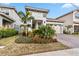 Beautiful home with landscaping, driveway, and two-car garage at 13567 Abberwick Dr, Orlando, FL 32832