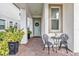 Charming front porch with seating area and lush greenery at 13567 Abberwick Dr, Orlando, FL 32832