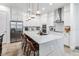 Modern kitchen with white cabinets, large island, and stainless steel appliances at 13567 Abberwick Dr, Orlando, FL 32832