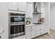Modern kitchen with stainless steel appliances and white cabinets at 13567 Abberwick Dr, Orlando, FL 32832