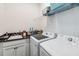 Convenient laundry room with washer, dryer, and extra counter space at 13567 Abberwick Dr, Orlando, FL 32832