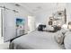 Bright main bedroom with a king bed, en-suite bathroom and home office at 13567 Abberwick Dr, Orlando, FL 32832