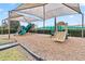 Play area with shaded structures and play equipment at 13567 Abberwick Dr, Orlando, FL 32832