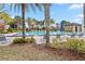 Community pool with lounge chairs and surrounding landscaping at 13567 Abberwick Dr, Orlando, FL 32832