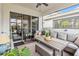 Relaxing screened patio with seating area and outdoor furniture at 13567 Abberwick Dr, Orlando, FL 32832