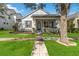 Charming single-story home with a well-manicured lawn, walkway, and a welcoming front porch at 14457 Jamaica Dogwood Dr, Orlando, FL 32828