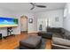 Bright living room with hardwood floors, a comfortable sectional sofa, and french doors to the exterior at 14457 Jamaica Dogwood Dr, Orlando, FL 32828