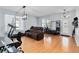 Bright living room boasts hardwood floors, modern lighting, and neutral paint at 14457 Jamaica Dogwood Dr, Orlando, FL 32828