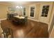 Dining room with hardwood floors, a wooden table, and bench seating at 1817 Kalurna Ct, Orlando, FL 32806