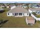 Aerial view showing house, shed, and yard at 193 Aurelia Ct, Kissimmee, FL 34758