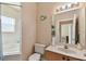 Bathroom with shower/tub combo, vanity, and toilet at 193 Aurelia Ct, Kissimmee, FL 34758