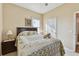 Bedroom with double bed, nightstands, and wood flooring at 193 Aurelia Ct, Kissimmee, FL 34758