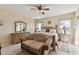 Main bedroom with a king bed and sitting area at 193 Aurelia Ct, Kissimmee, FL 34758