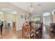 Dining area with hardwood floors and view into kitchen at 193 Aurelia Ct, Kissimmee, FL 34758