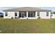 House back view with screened porch and yard at 193 Aurelia Ct, Kissimmee, FL 34758