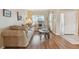 Living room featuring beige couch and wood flooring at 193 Aurelia Ct, Kissimmee, FL 34758