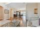 Open living space with hardwood floors and glass-top coffee table at 193 Aurelia Ct, Kissimmee, FL 34758