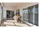 Bright screened porch with tile floor and seating area at 193 Aurelia Ct, Kissimmee, FL 34758