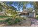 Large backyard with lush landscaping and spacious patio at 2061 Petit Ct, Apopka, FL 32712