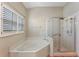 Bathroom with corner tub and walk-in shower at 2061 Petit Ct, Apopka, FL 32712