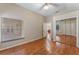 Bright bedroom with mirrored closet and hardwood floors at 2061 Petit Ct, Apopka, FL 32712