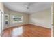Bright bedroom with wood floors and sliding door access at 2061 Petit Ct, Apopka, FL 32712