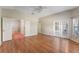 Main bedroom with wood floors and access to bathroom and patio at 2061 Petit Ct, Apopka, FL 32712