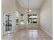 Dining room with tile floors and multiple windows at 2061 Petit Ct, Apopka, FL 32712